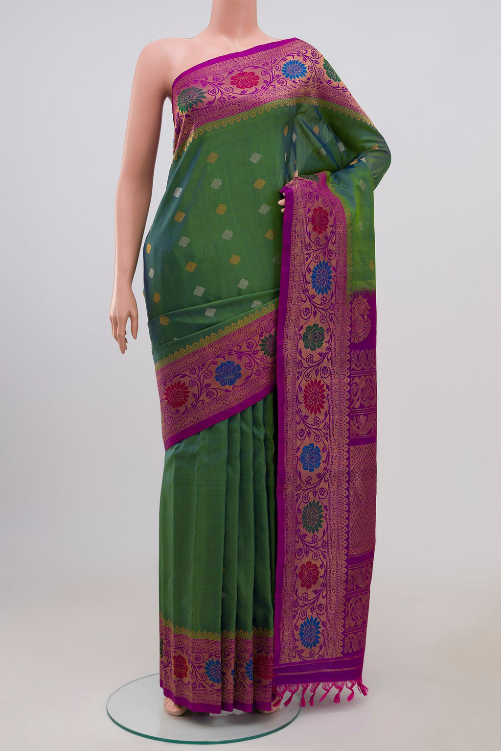 Green Gadwal Silk Saree with Zari Butta on the body and Zari Border.  displayed on a mannequin