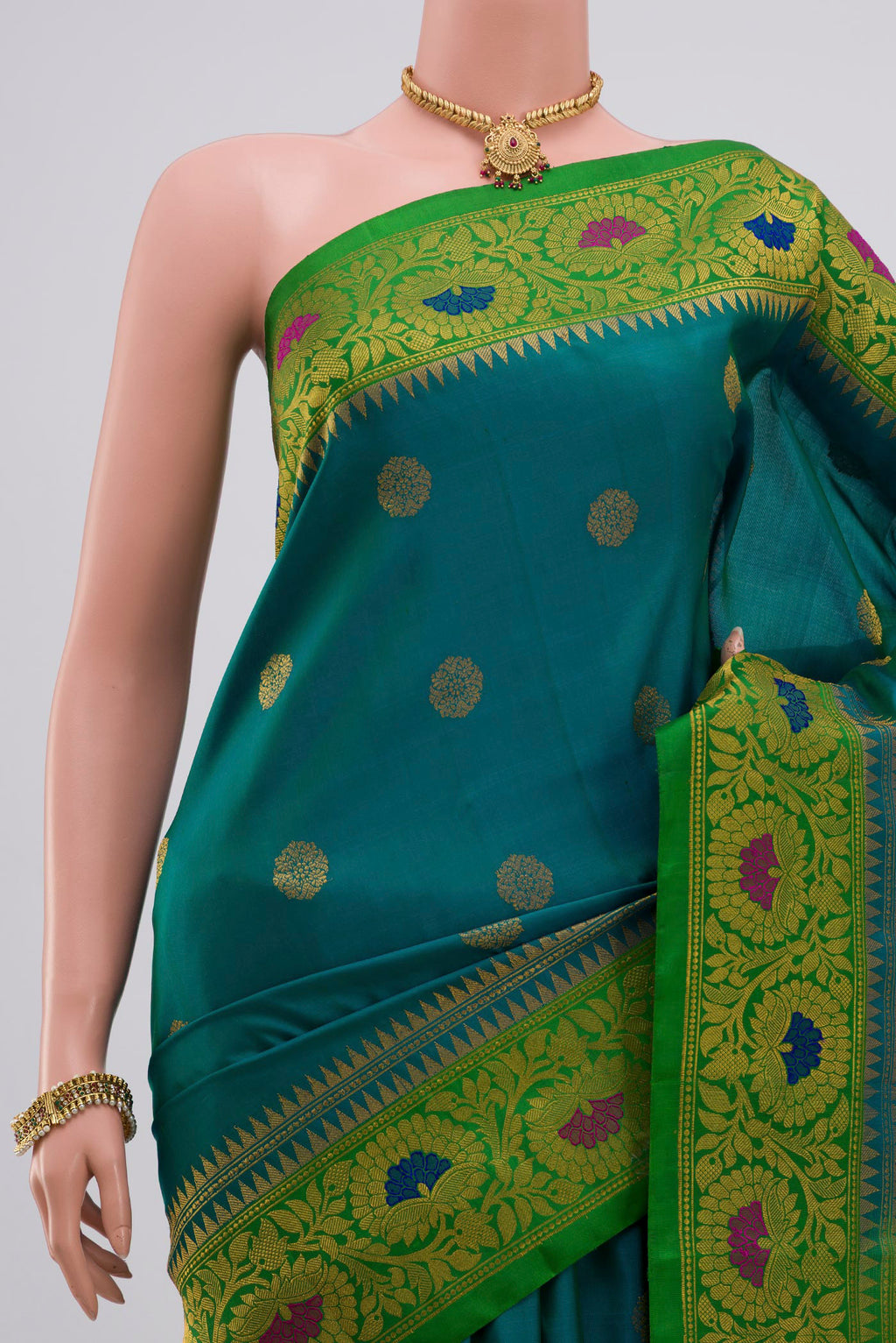 Border image of Peacock Blue Gadwal Silk Saree with Zari Butta on the body and Zari Border. 