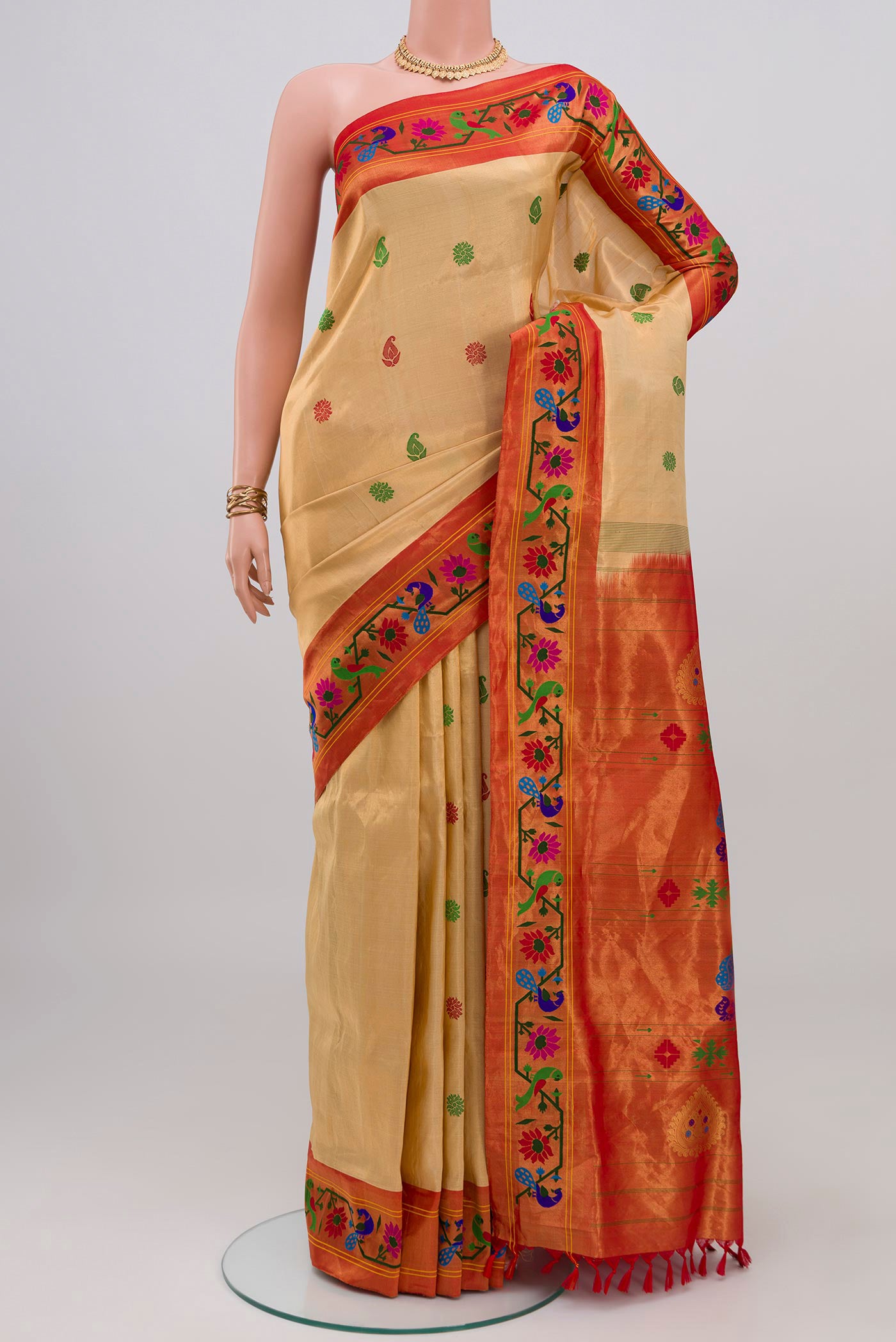 Sandal Paithani Silk Saree with Thread Butta on the body and Paithani Border.  displayed on a mannequin