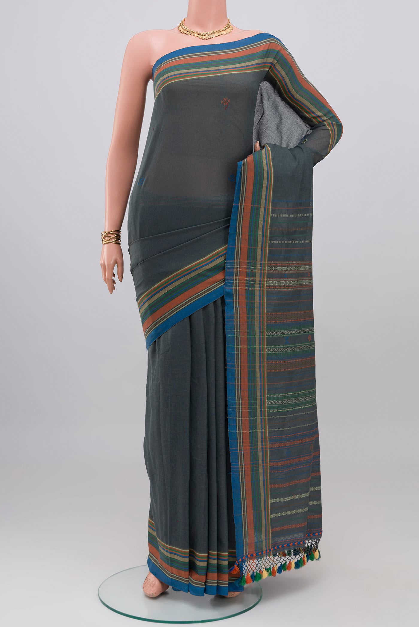 Blue Grey Cotton Saree with Thread Butta on the body and Thread Border.  displayed on a mannequin