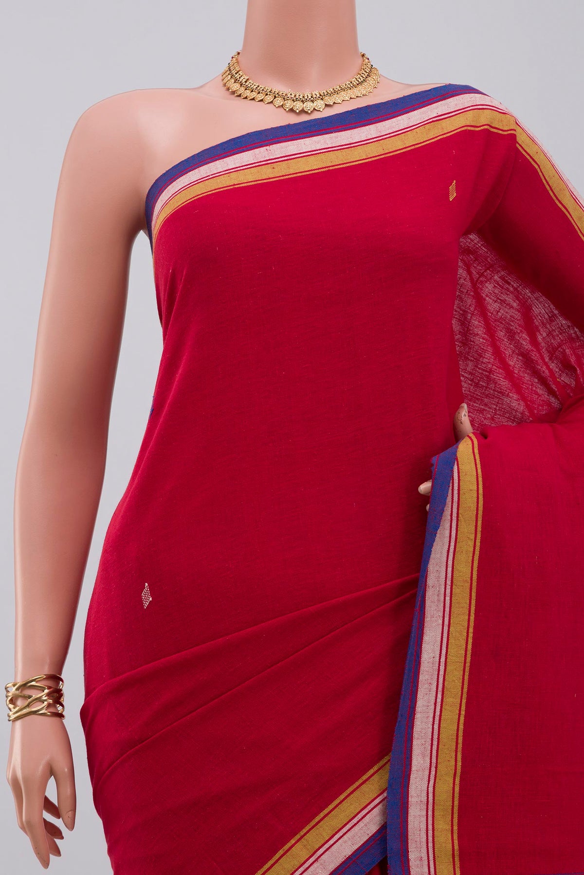 Border image of Red Assam Cotton Saree with Thread Butta on the body and Thread Border. 