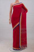 Red Assam Cotton Saree with Thread Butta on the body and Thread Border.  displayed on a mannequin