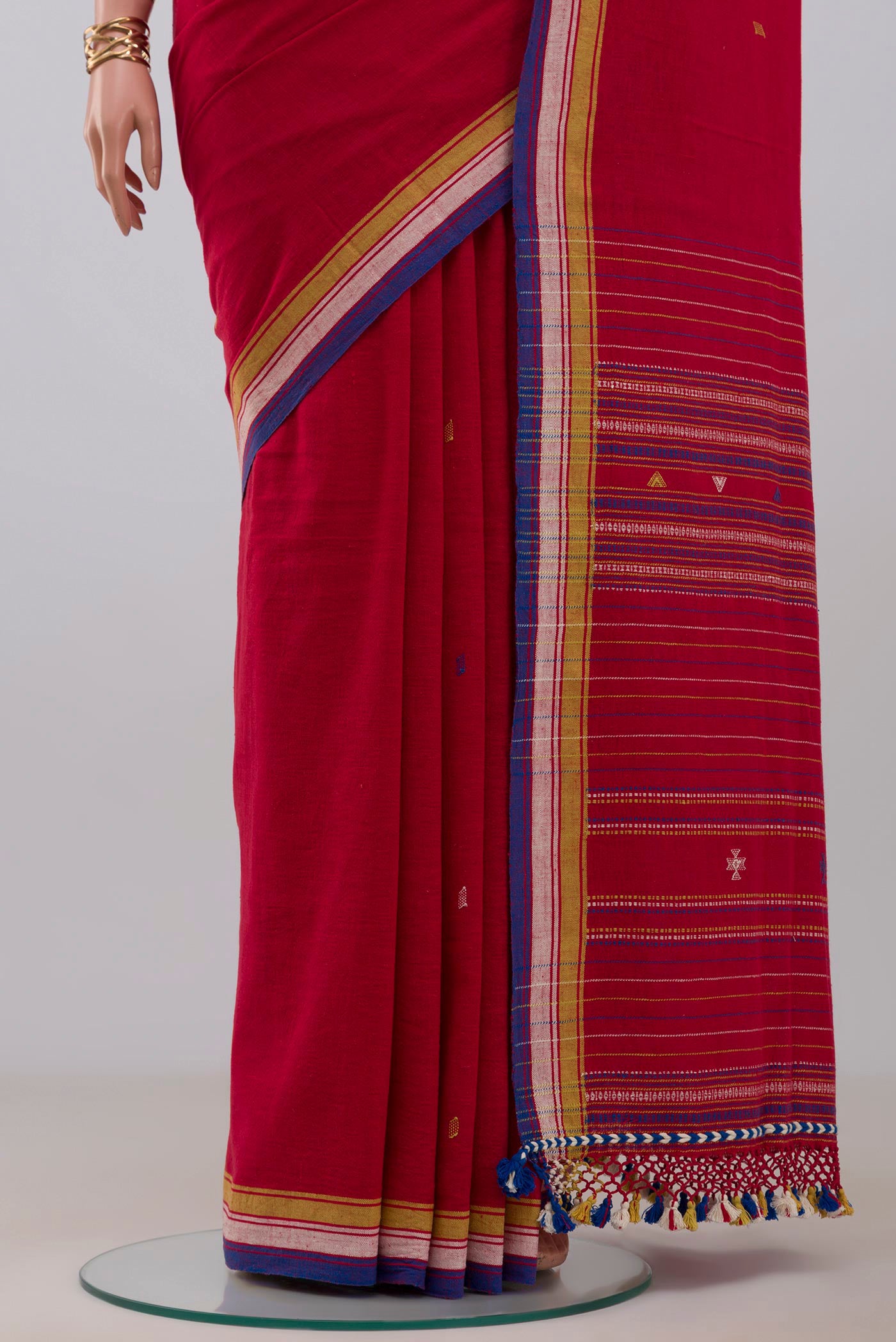 Pleats and pallu of Red Assam Cotton Saree with Thread Butta on the body and Thread Border. 