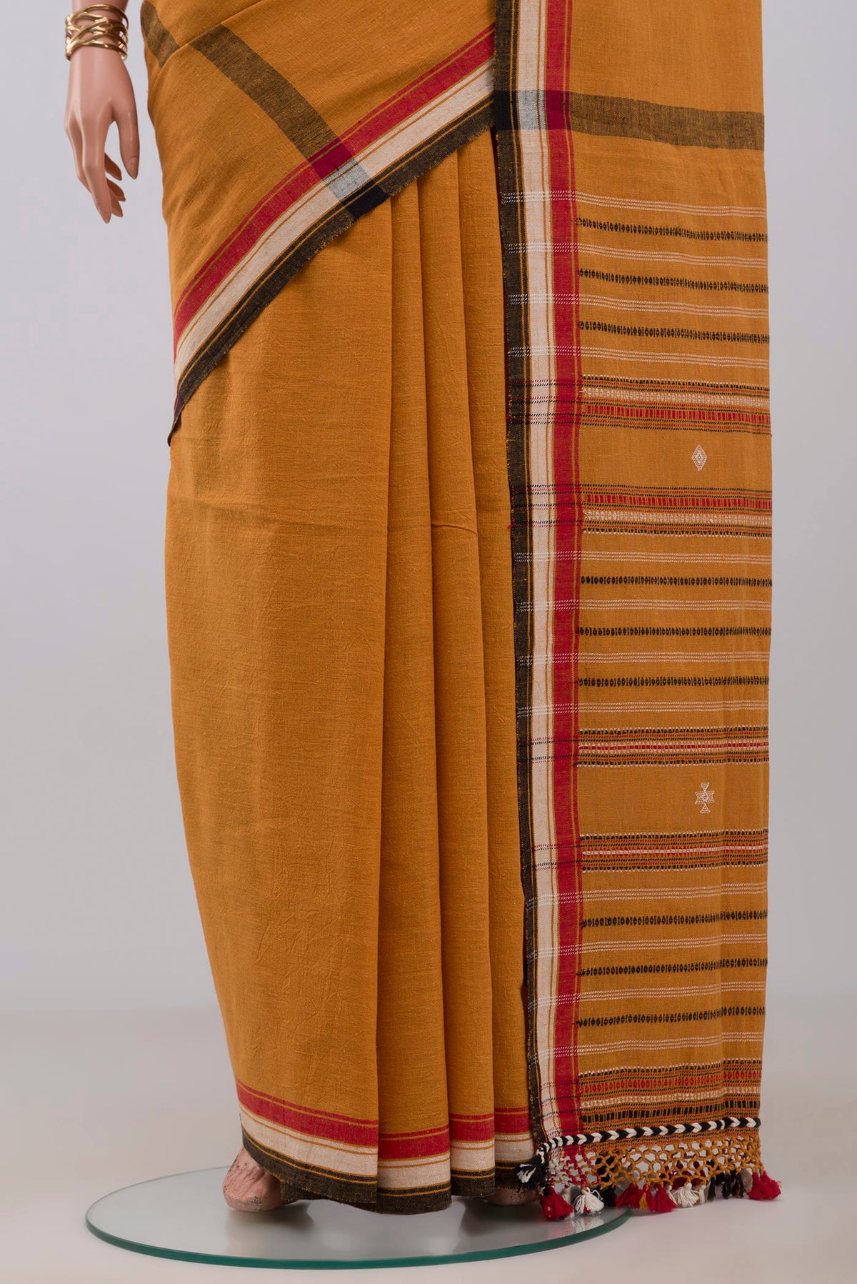 Pleats and pallu of Yellow Assam Cotton Saree with Plain Body and Thread Border. 