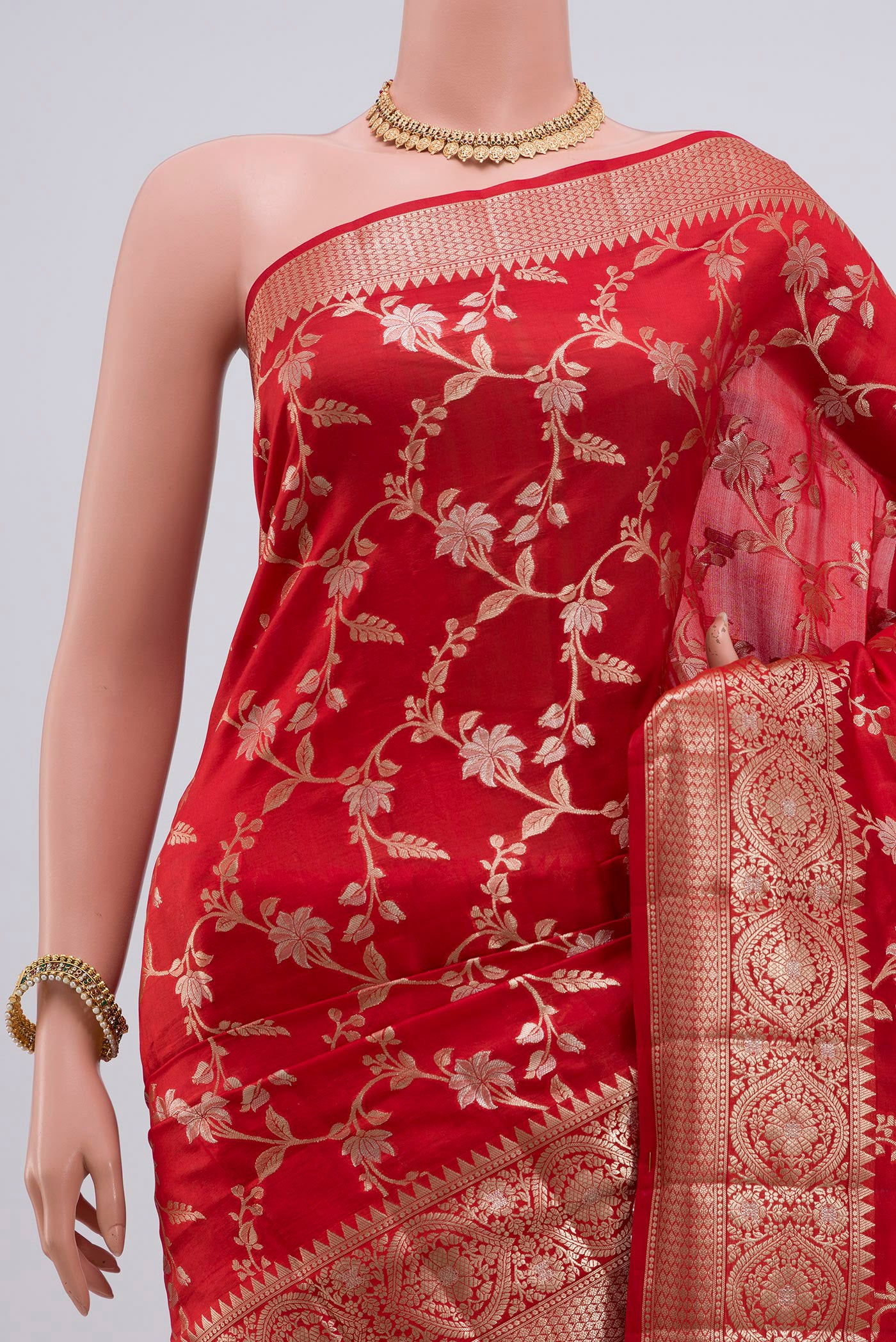 Border image of Red Raw Silk Saree with Zari Butta on the body and Zari Border. 