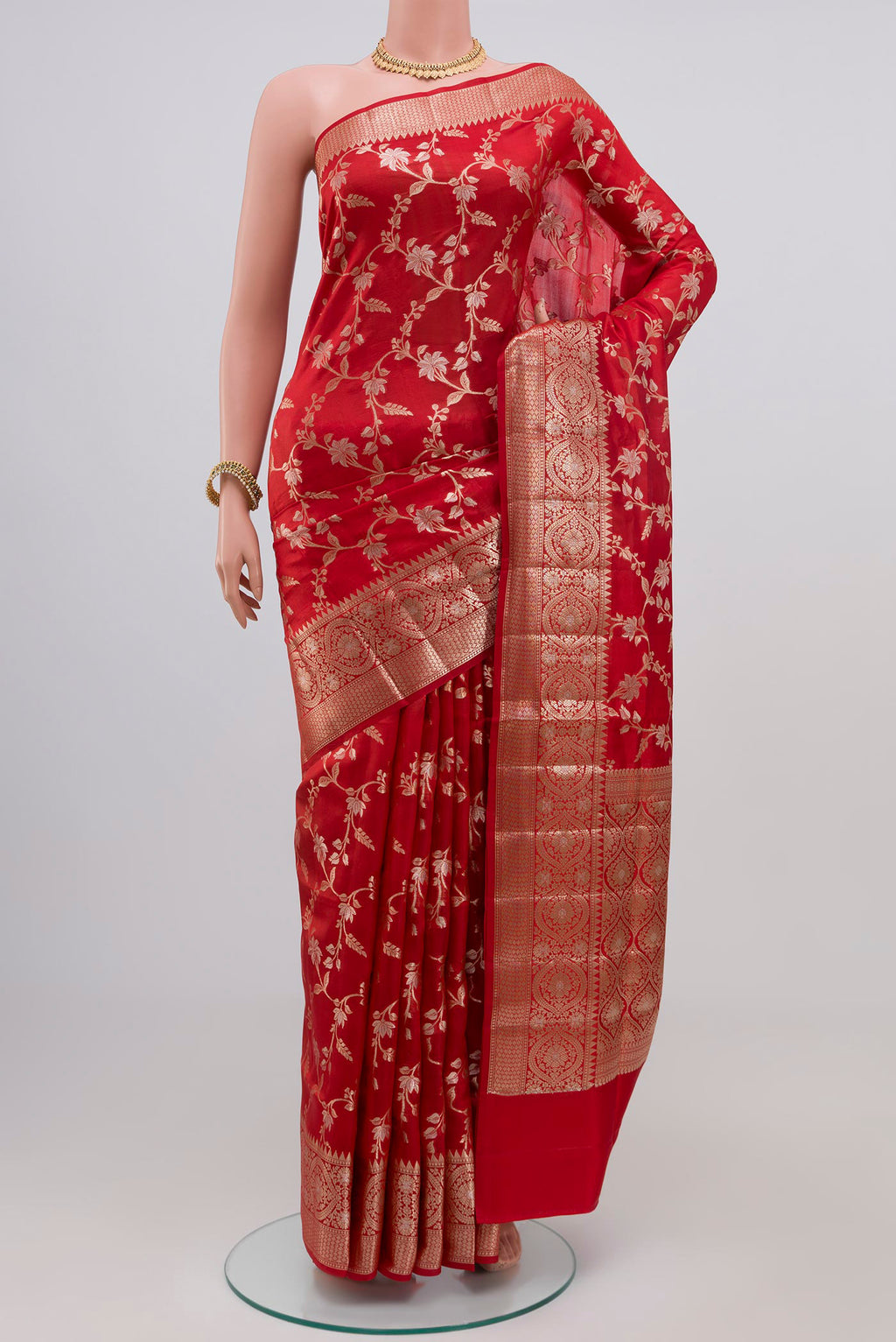 Red Raw Silk Saree with Zari Butta on the body and Zari Border.  displayed on a mannequin