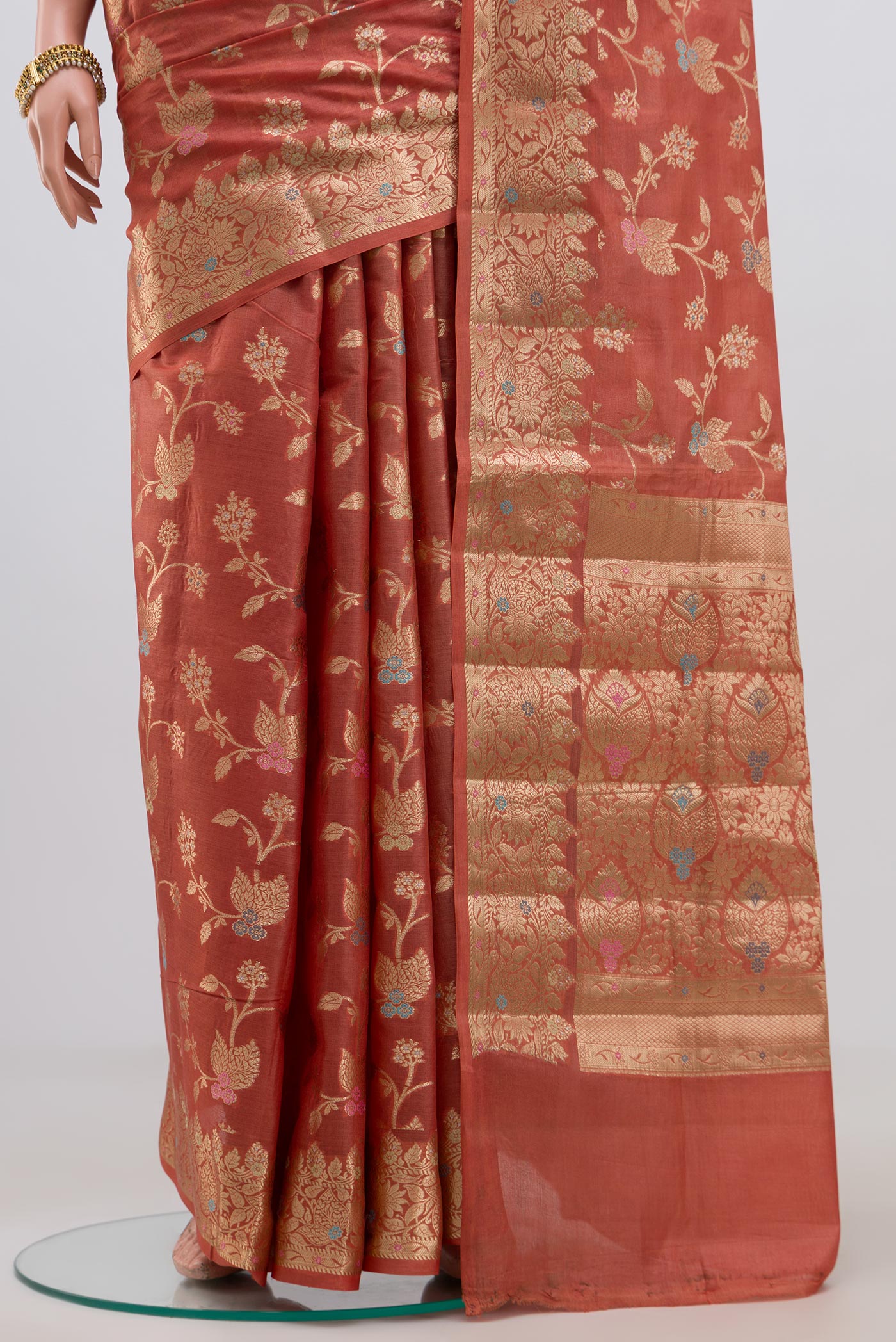 Pleats and pallu of Peach Tussar Silk Saree with Fancy on the body and Zari Border. 