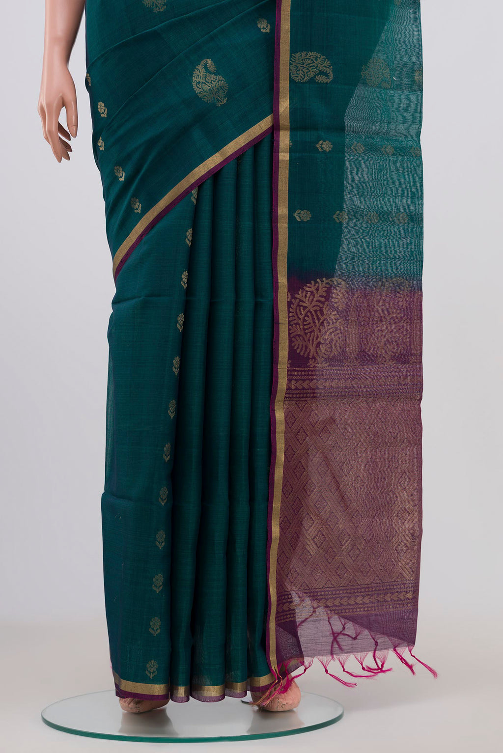 Pleats and pallu of Peacock Blue Silk Cotton Saree with Zari Butta on the body and Thin Zari Line. 