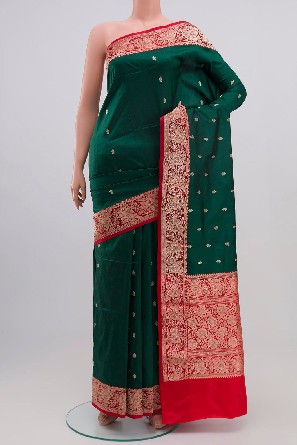 Green Banarasi Katan Silk Saree with Zari Butta on the body and Zari Border.  displayed on a mannequin