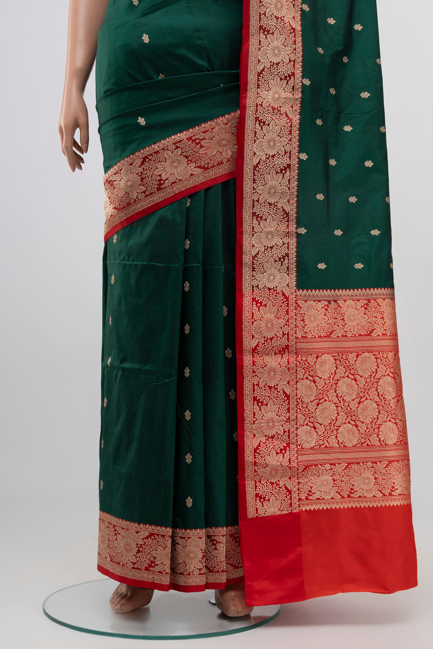 Pleats and pallu of Green Banarasi Katan Silk Saree with Zari Butta on the body and Zari Border. 
