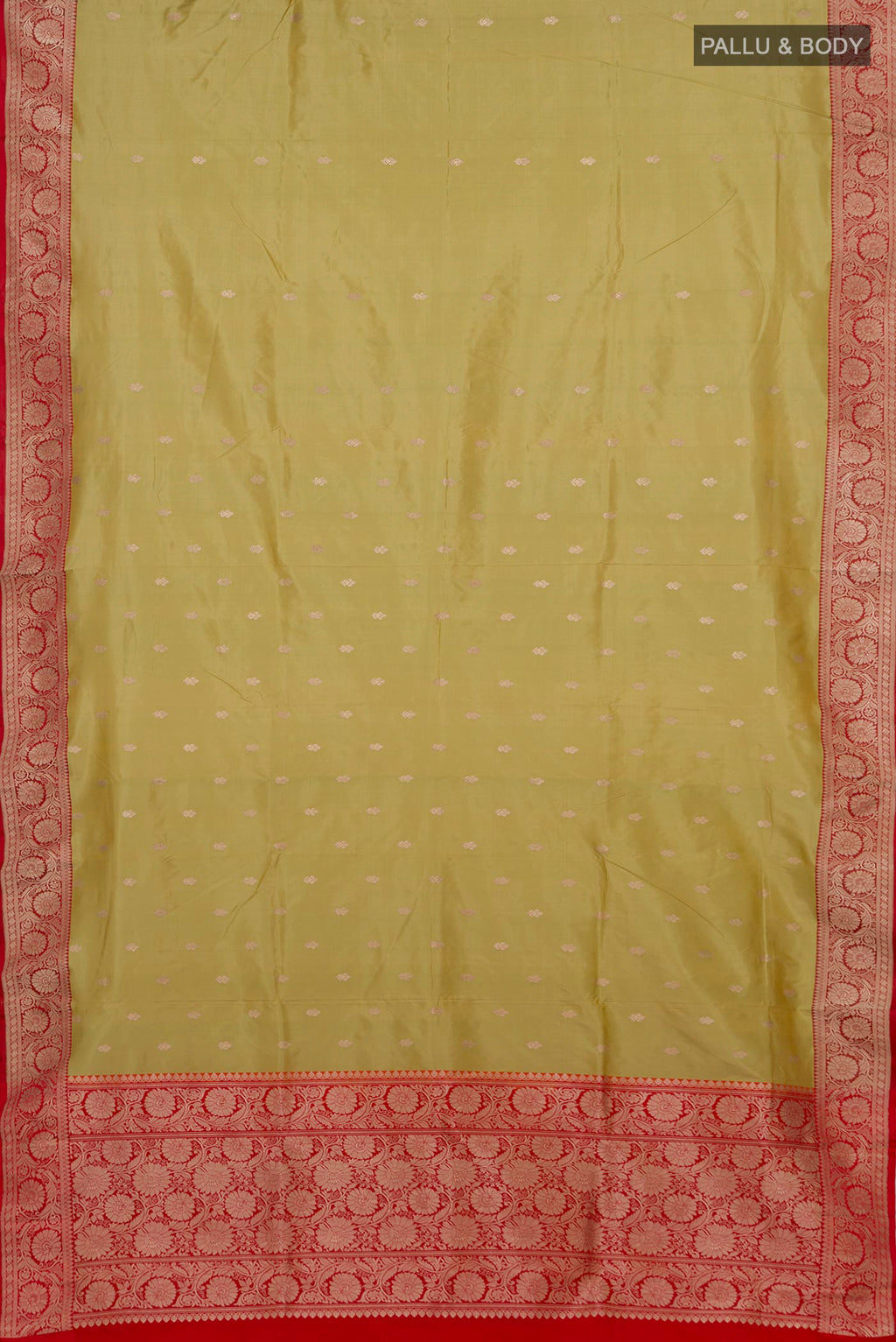 Flat view of Pista Green Banarasi Katan Silk Saree with Zari Butta on the body and Zari Border. 
