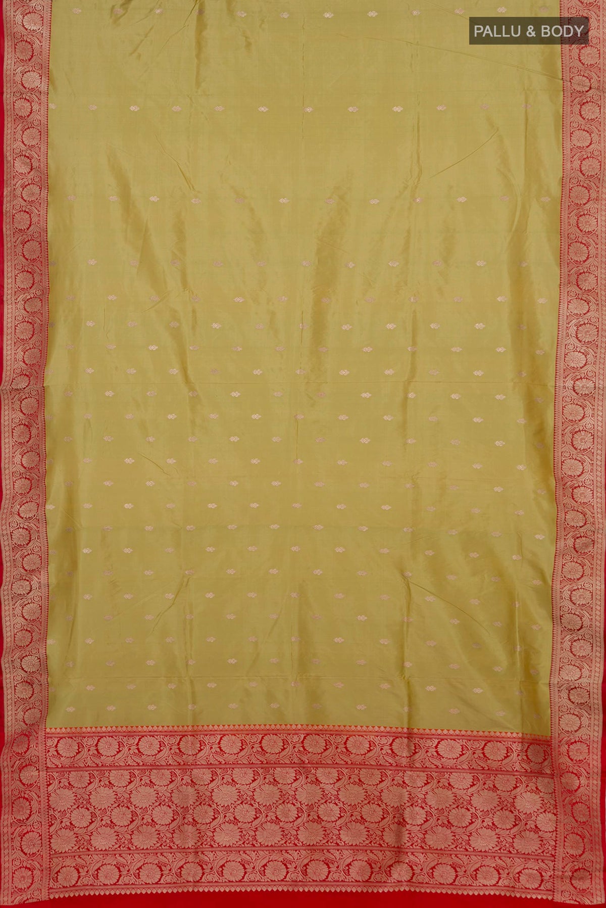 Flat view of Pista Green Banarasi Katan Silk Saree with Zari Butta on the body and Zari Border. 