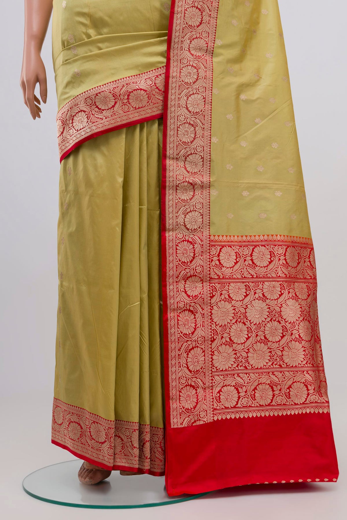 Pleats and pallu of Pista Green Banarasi Katan Silk Saree with Zari Butta on the body and Zari Border. 