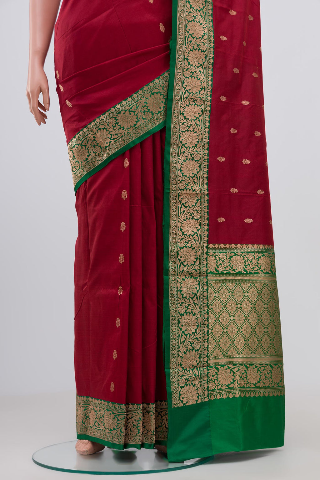 Pleats and pallu of Maroon Banarasi Katan Silk Saree with Zari Butta on the body and Zari Border. 