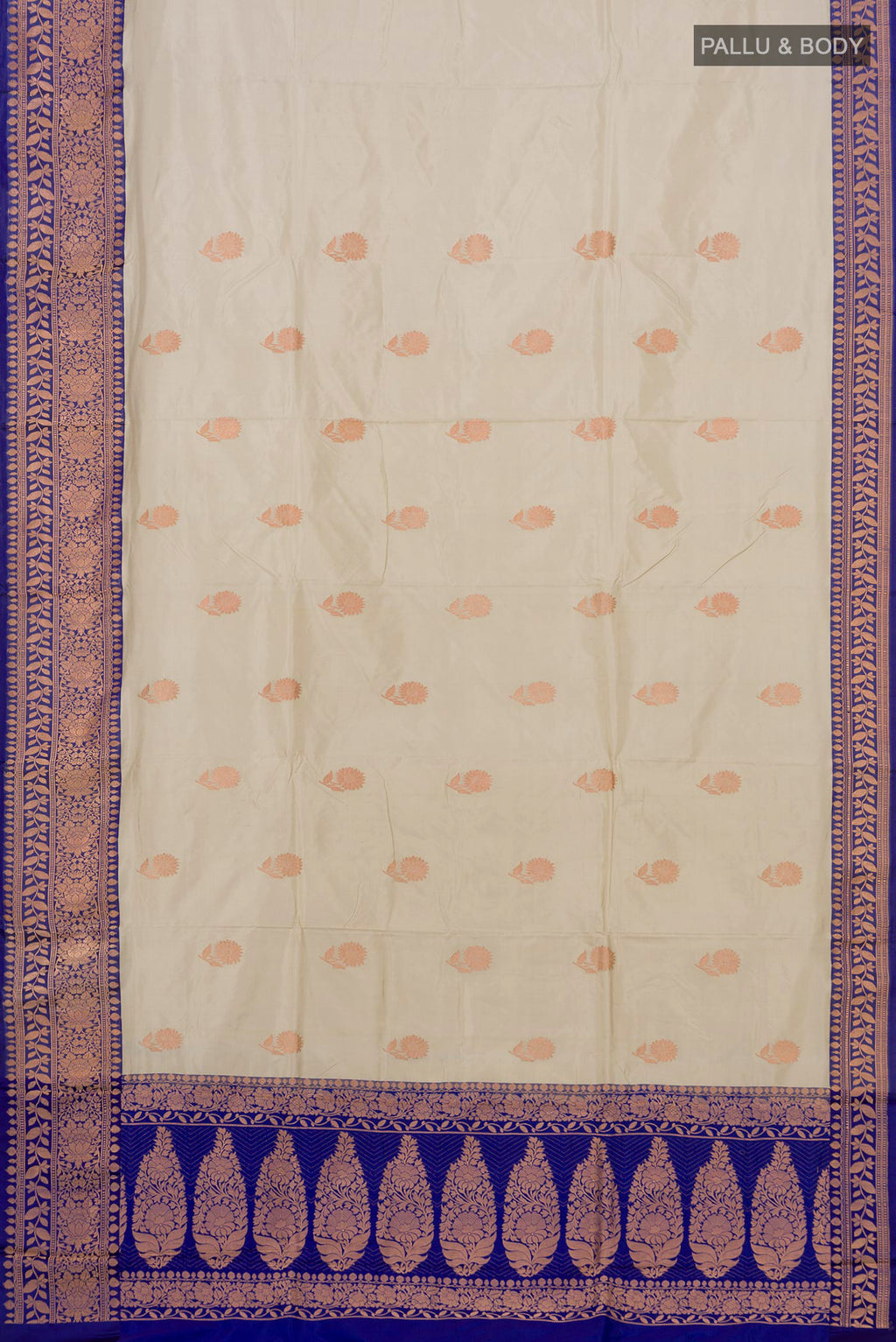 Flat view of Cream Banarasi Katan Silk Saree with Zari Butta on the body and Zari Border. 