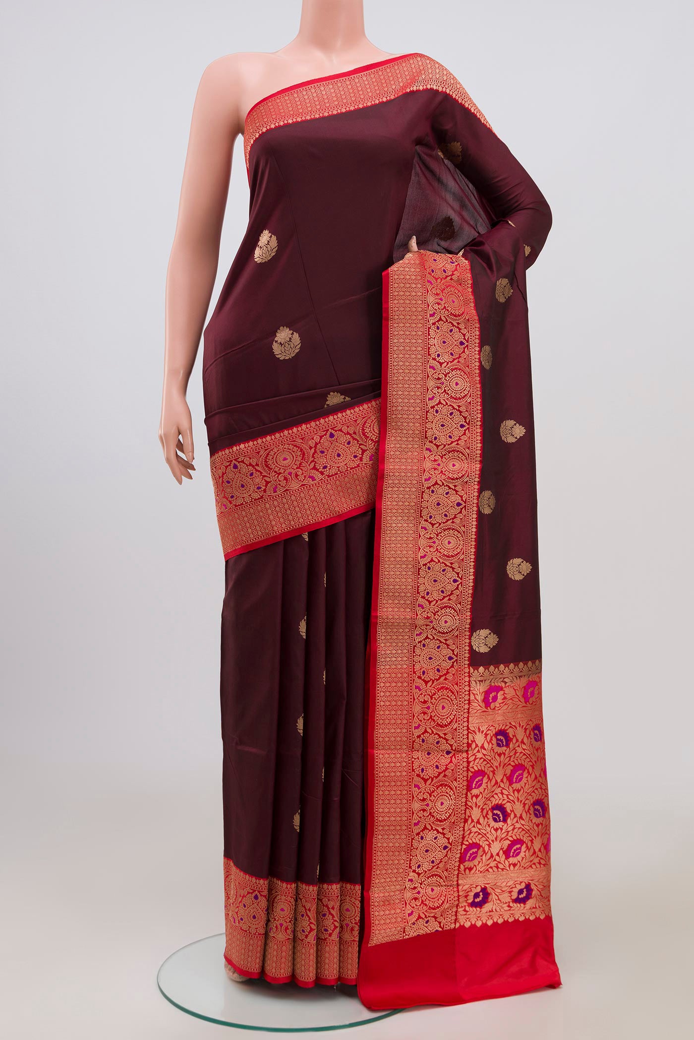 Brown Banarasi Katan Silk Saree with Zari Butta on the body and Zari Border.  displayed on a mannequin