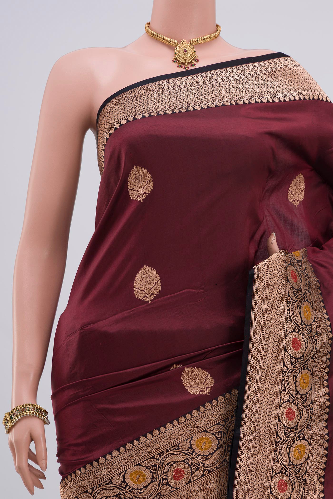 Border image of Maroon Banarasi Katan Silk Saree with Zari Butta on the body and Zari Border. 