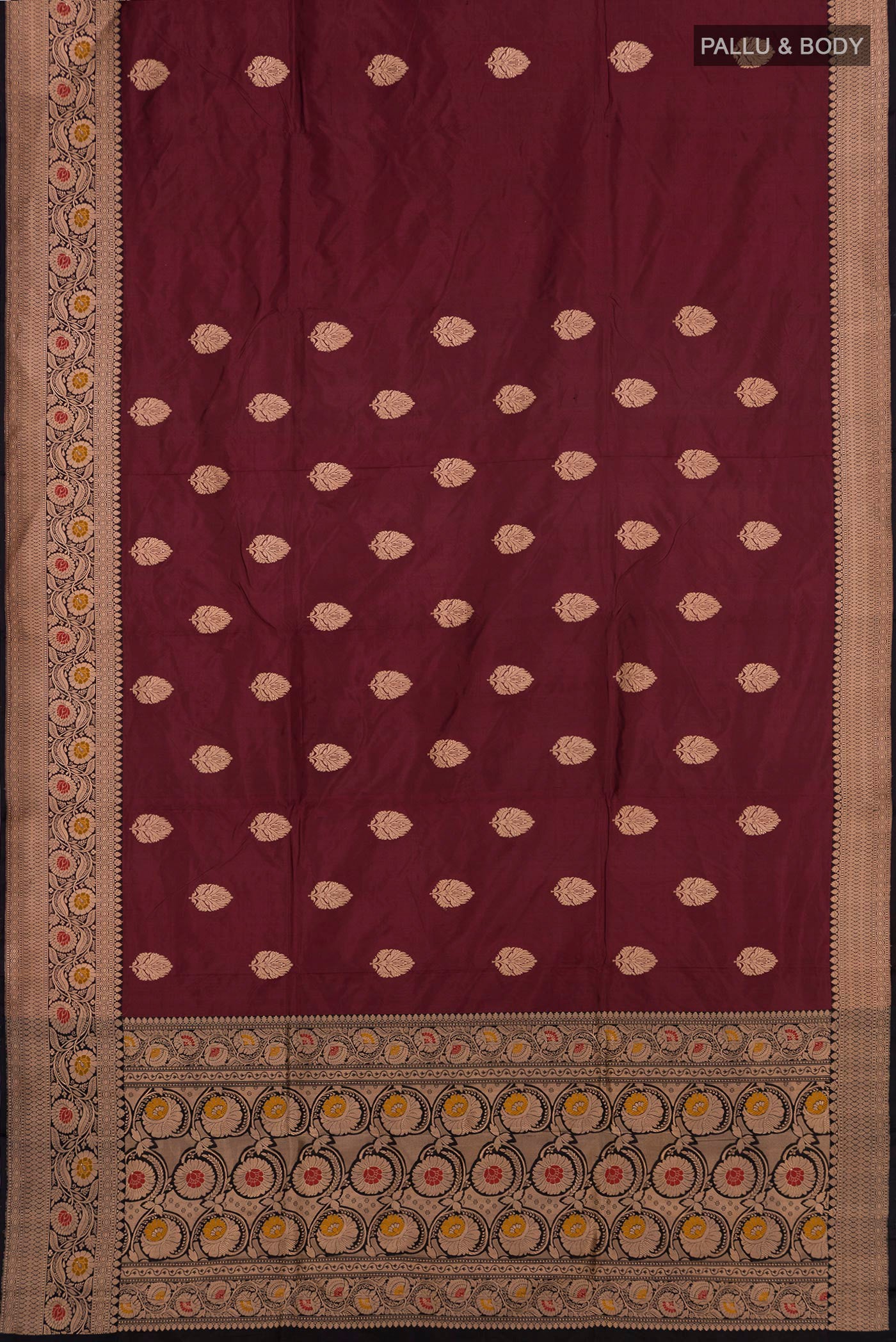 Flat view of Maroon Banarasi Katan Silk Saree with Zari Butta on the body and Zari Border. 