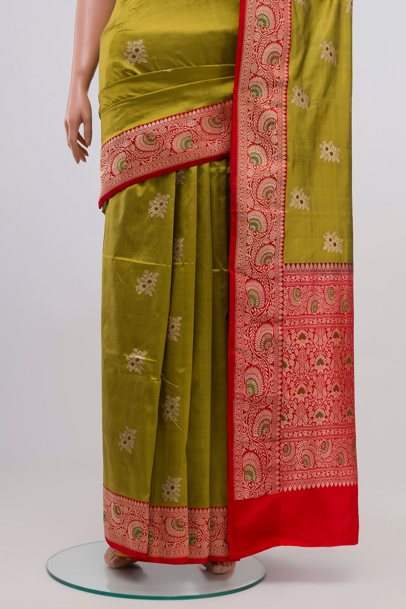 Pleats and pallu of Green Banarasi Katan Silk Saree with Zari Butta on the body and Zari Border. 
