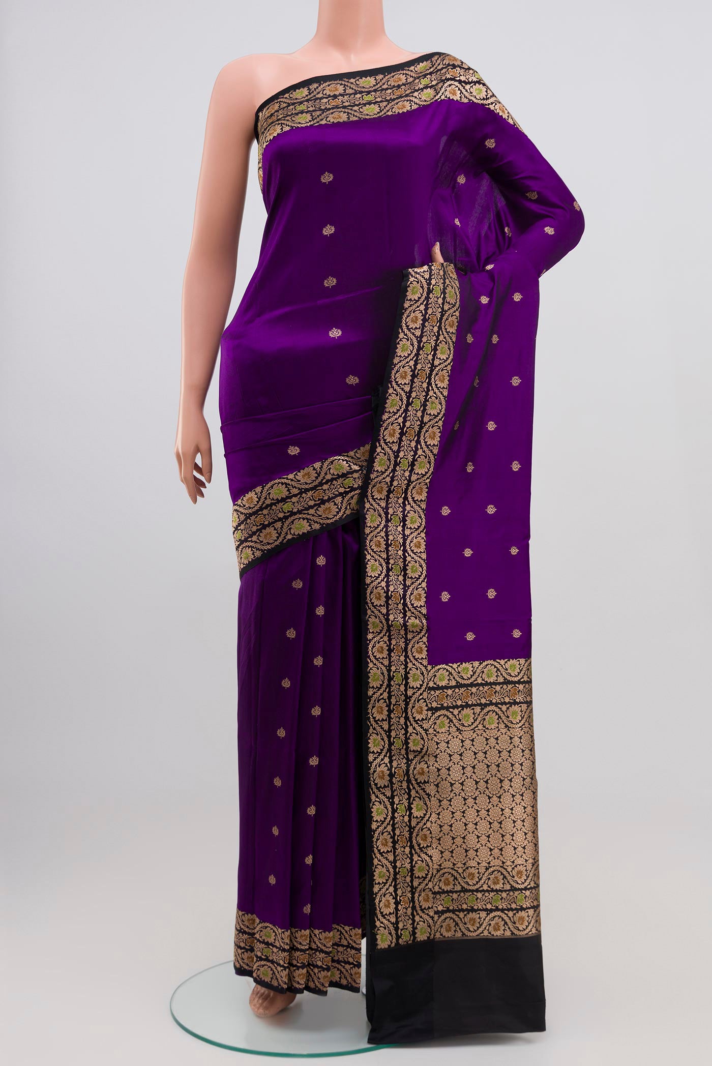 Violet Banarasi Katan Silk Saree with Zari Butta on the body and Zari Border.  displayed on a mannequin