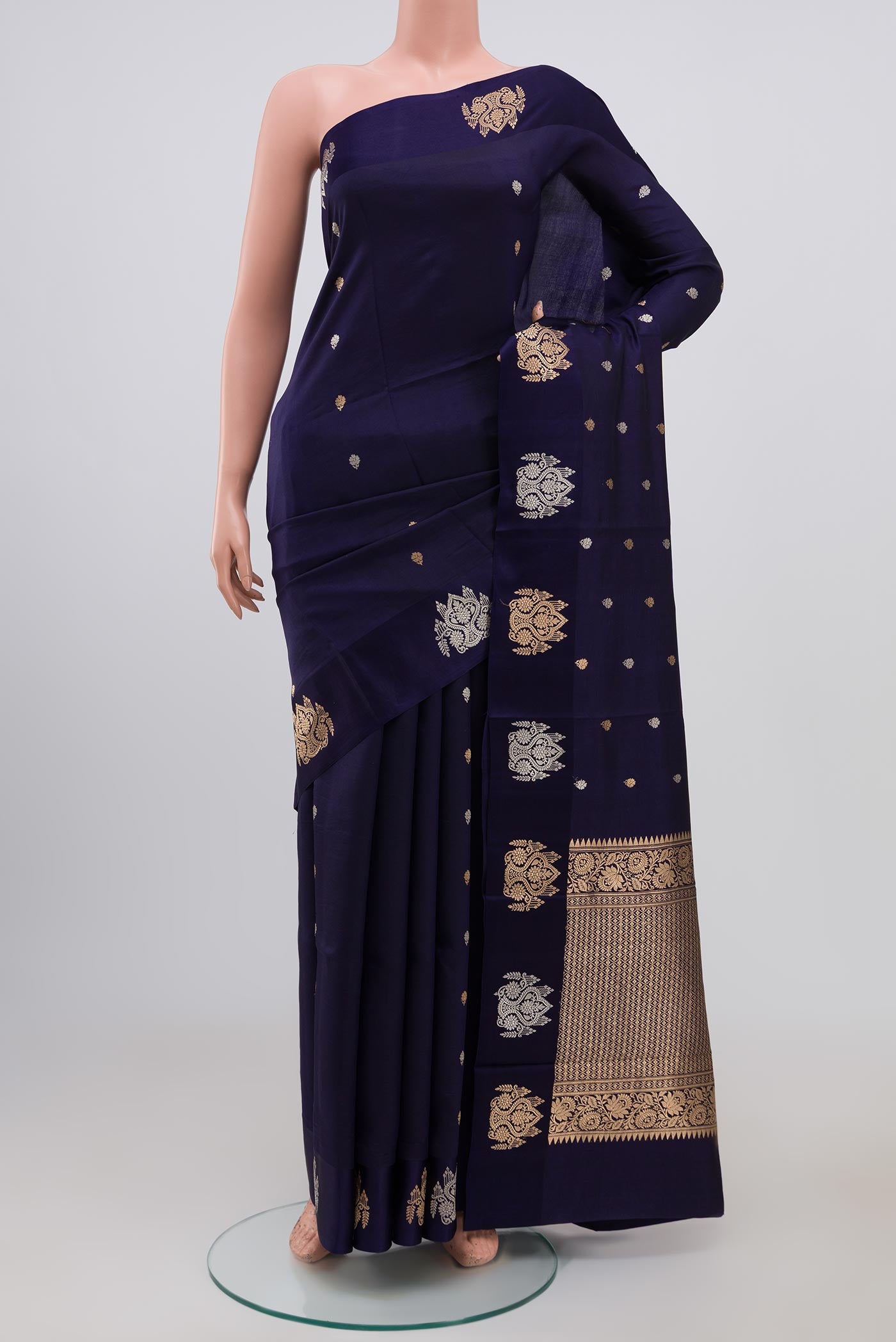 Blue Banarasi Katan Silk Saree with Zari Butta on the body and Fancy Border.  displayed on a mannequin