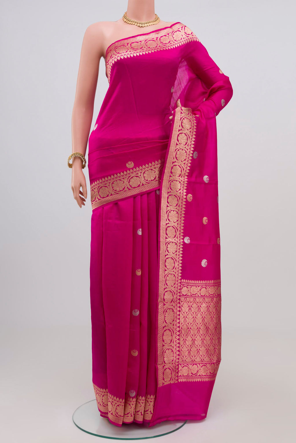 Dark Pink Banarasi Katan Silk Saree with Zari Butta on the body and Zari Border.  displayed on a mannequin