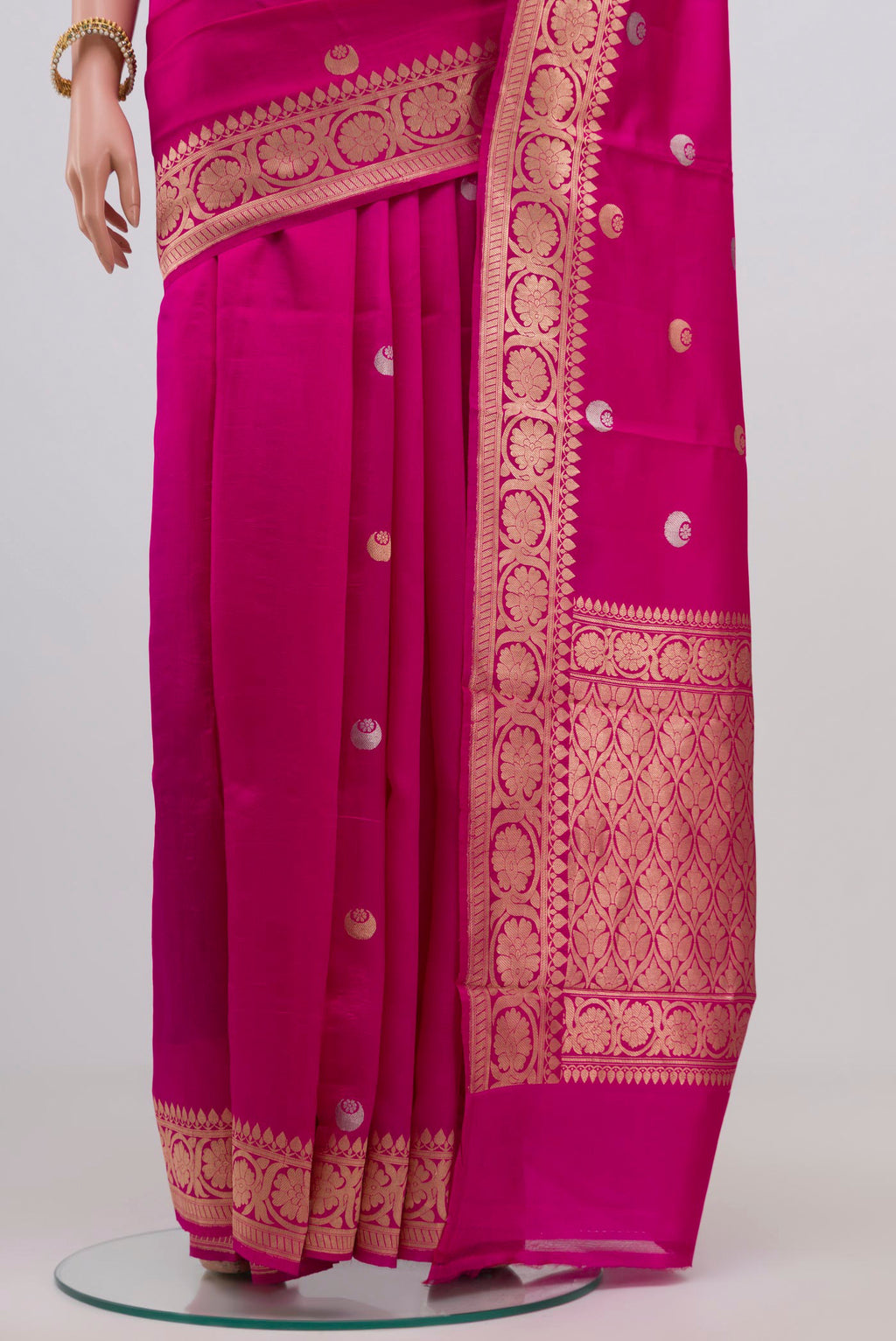 Pleats and pallu of Dark Pink Banarasi Katan Silk Saree with Zari Butta on the body and Zari Border. 