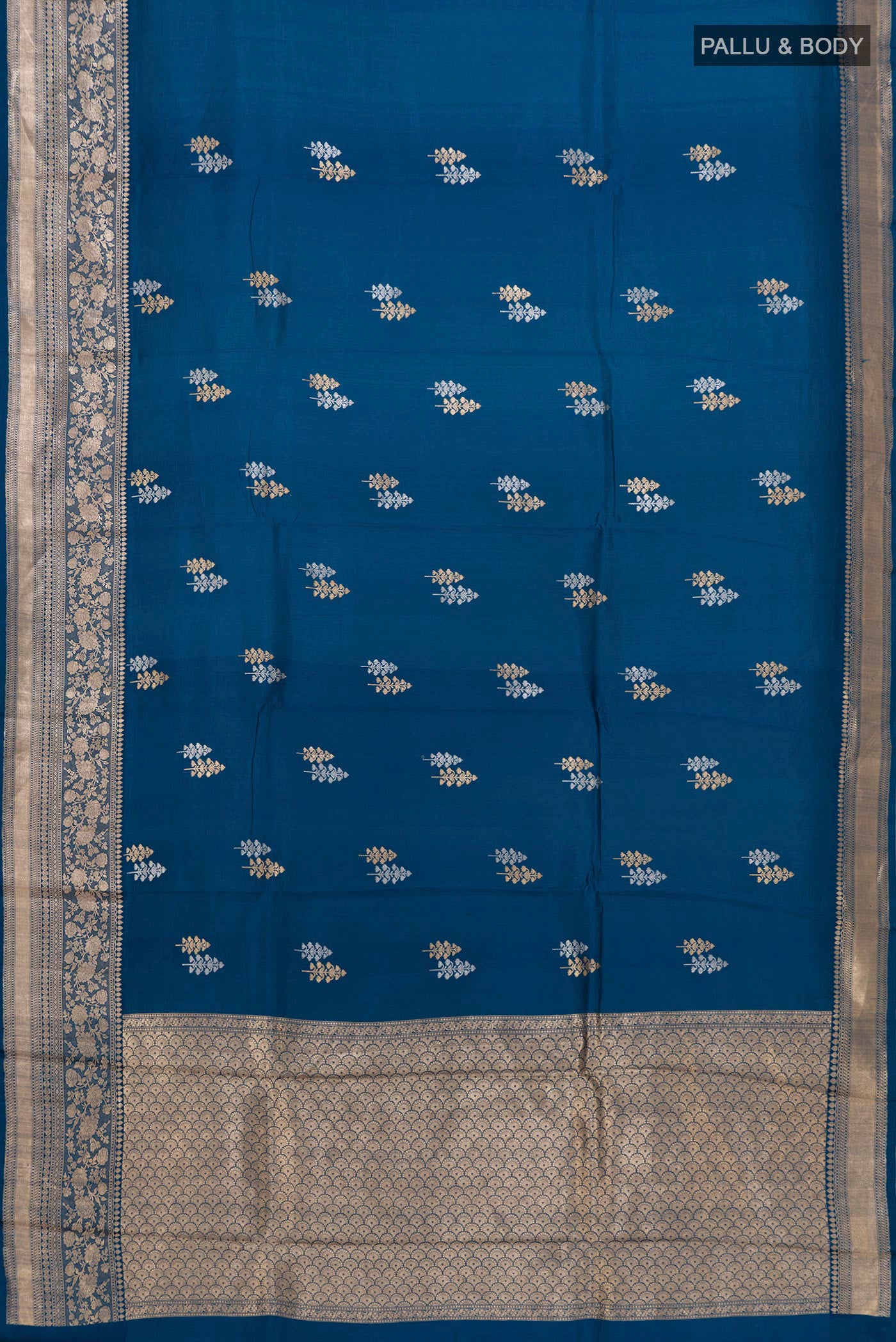 Flat view of Blue Banarasi Katan Silk Saree with Zari Butta on the body and Zari Border. 