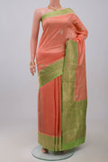 Peach Banarasi Katan Silk Saree with Zari Butta on the body and Fancy Border.  displayed on a mannequin