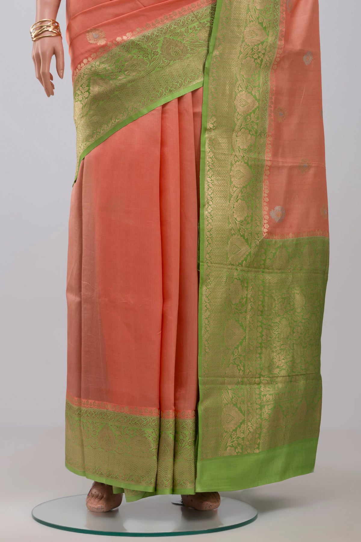 Pleats and pallu of Peach Banarasi Katan Silk Saree with Zari Butta on the body and Fancy Border. 