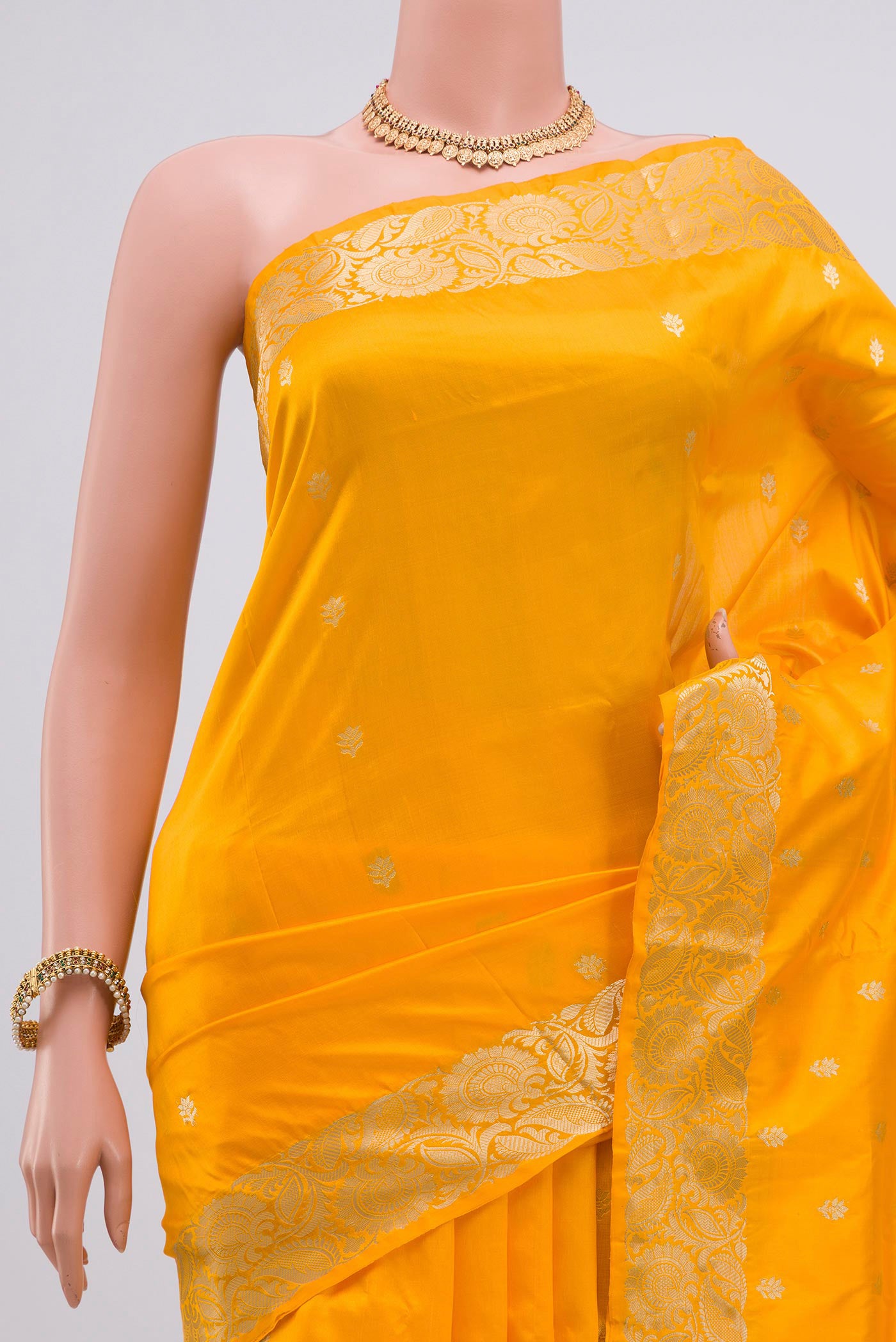 Border image of Yellow Banarasi Katan Silk Saree with Zari Butta on the body and Zari Border. 