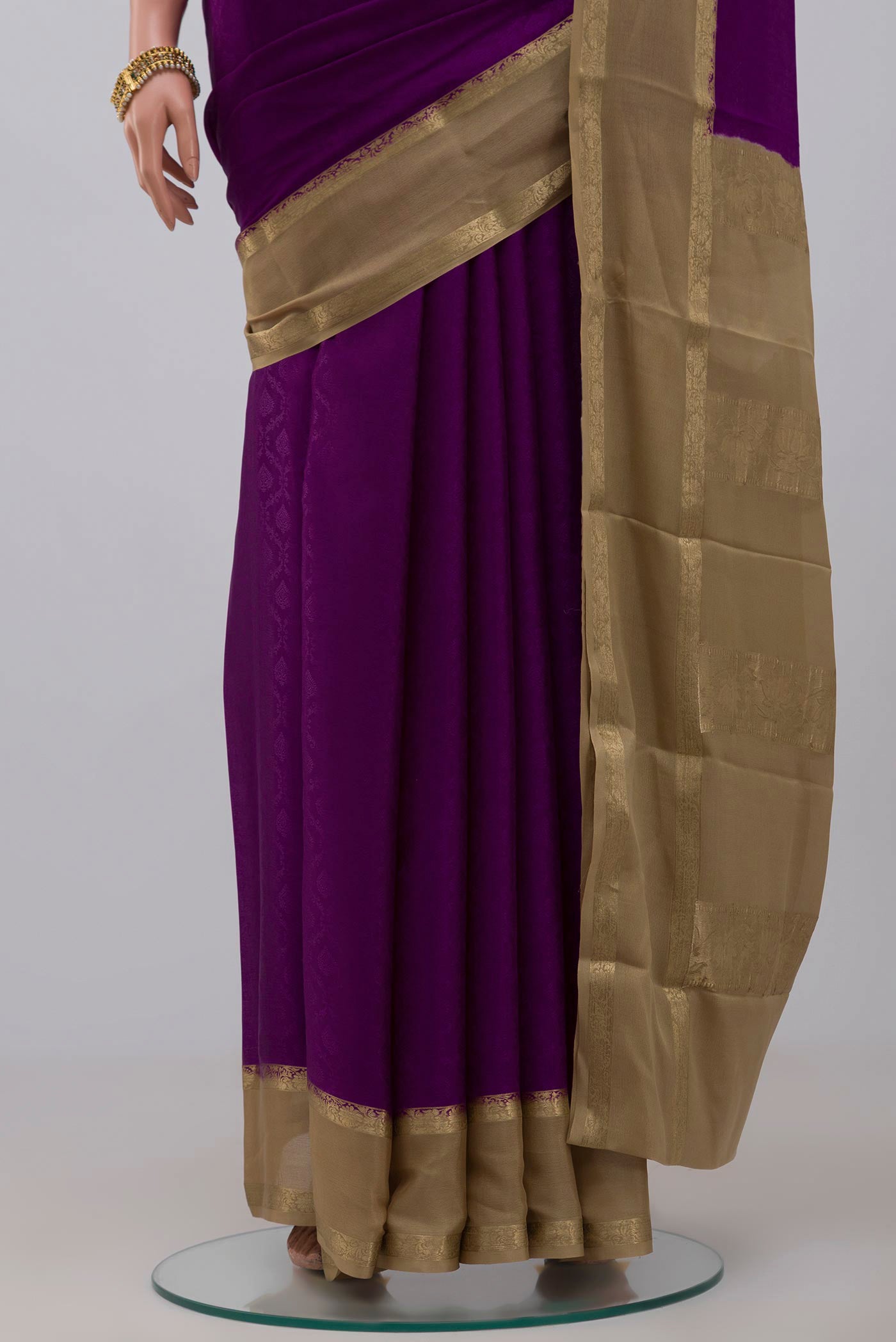 Pleats and pallu of Purple Crepe Saree with Jacquard design on the body and Thin Zari Line. 