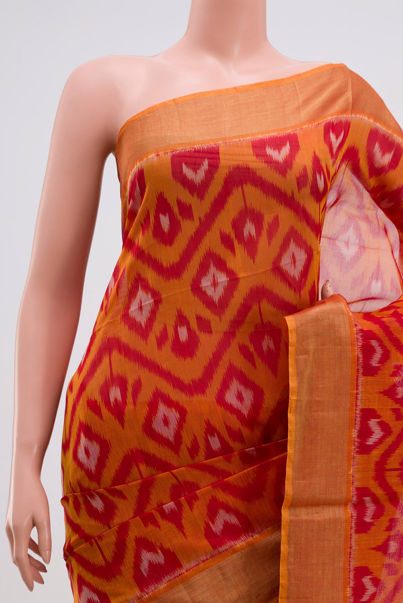 Border image of Red Coimbatore Silk Cotton Saree with Ikat Print on the body and Zari Border. 