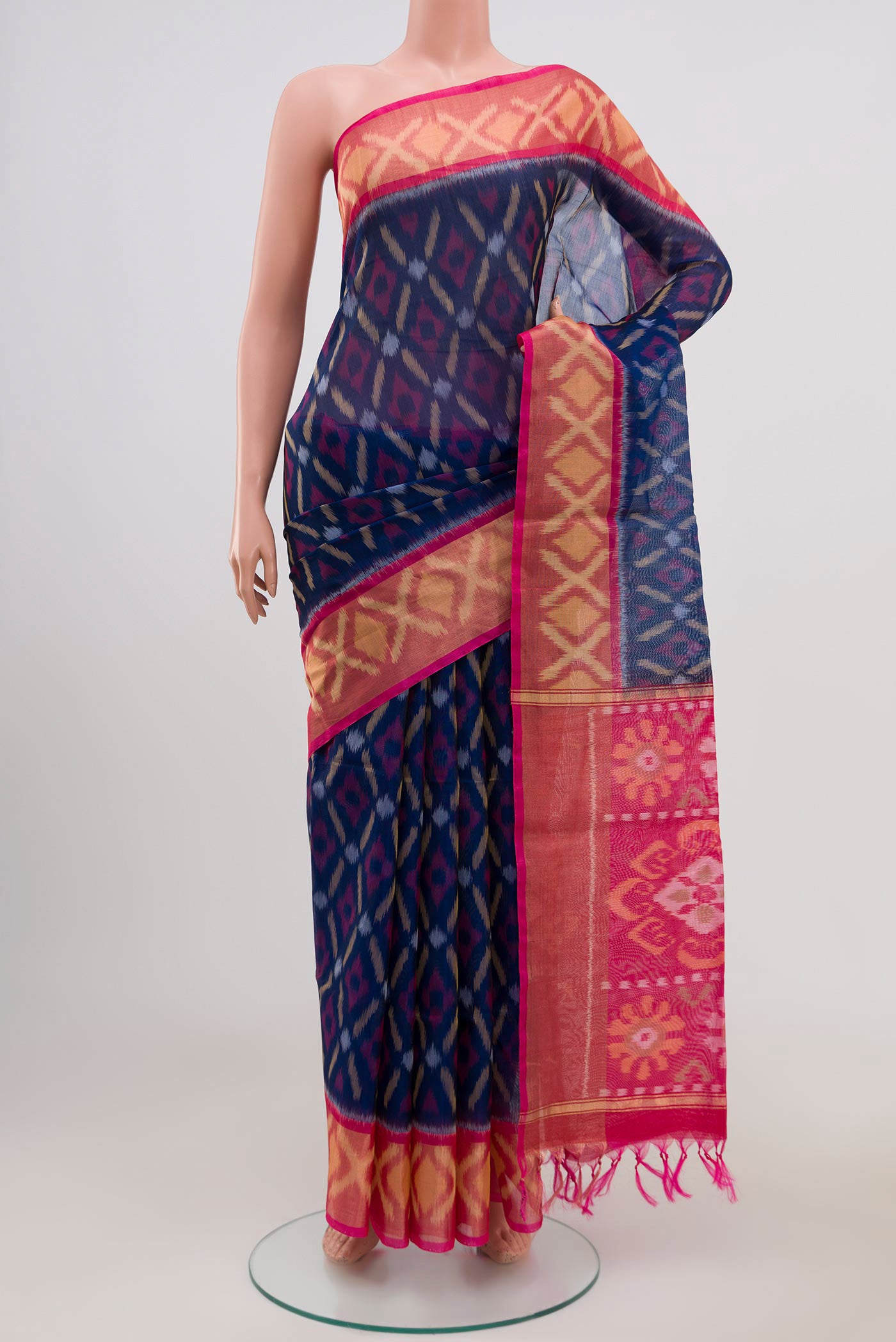 Navy Blue Coimbatore Silk Cotton Saree with Ikat Print on the body and Zari Border.  displayed on a mannequin