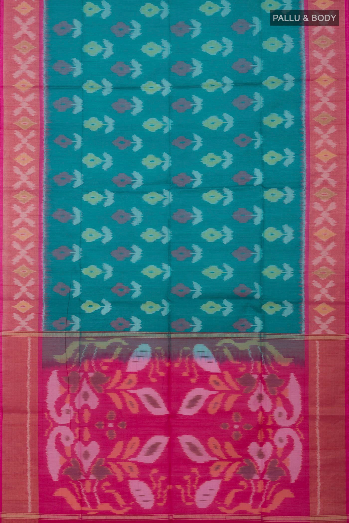 Flat view of Green Silk Cotton Saree with Ikat design on the body and Zari Border. 
