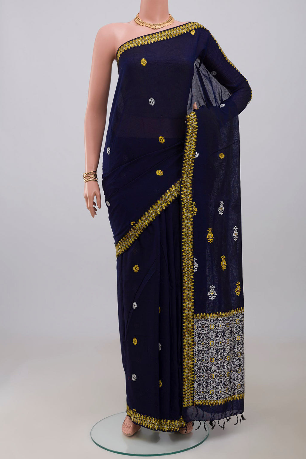 Blue Assam Cotton Saree with Thread Butta on the body and Thread Border.  displayed on a mannequin