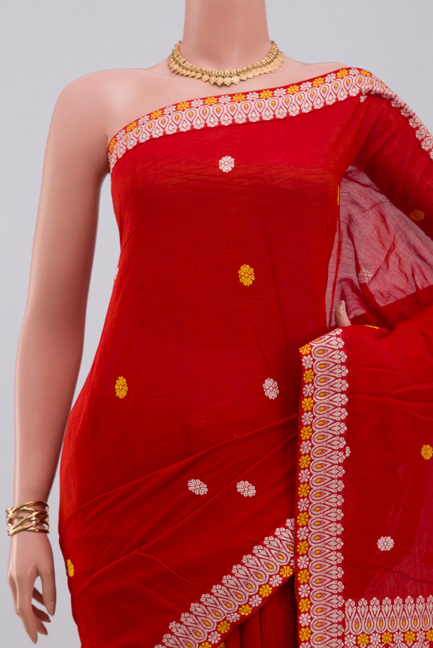 Border image of Red Assam Cotton Saree with Thread Butta on the body and Thread Border. 