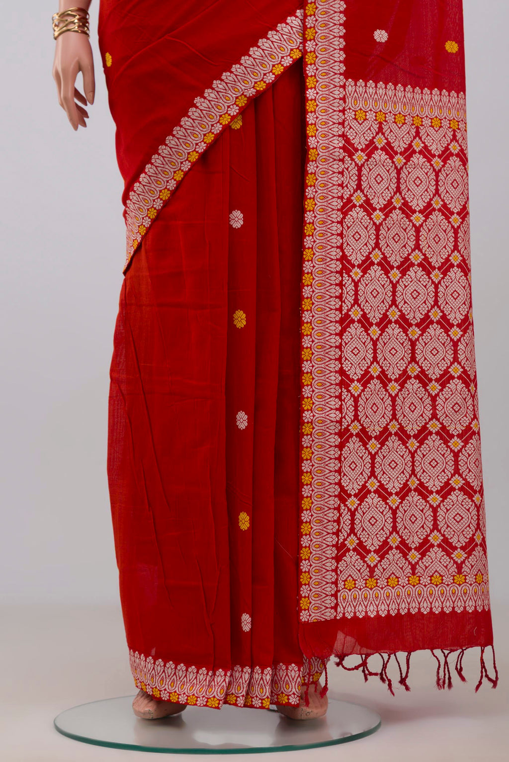 Pleats and pallu of Red Assam Cotton Saree with Thread Butta on the body and Thread Border. 