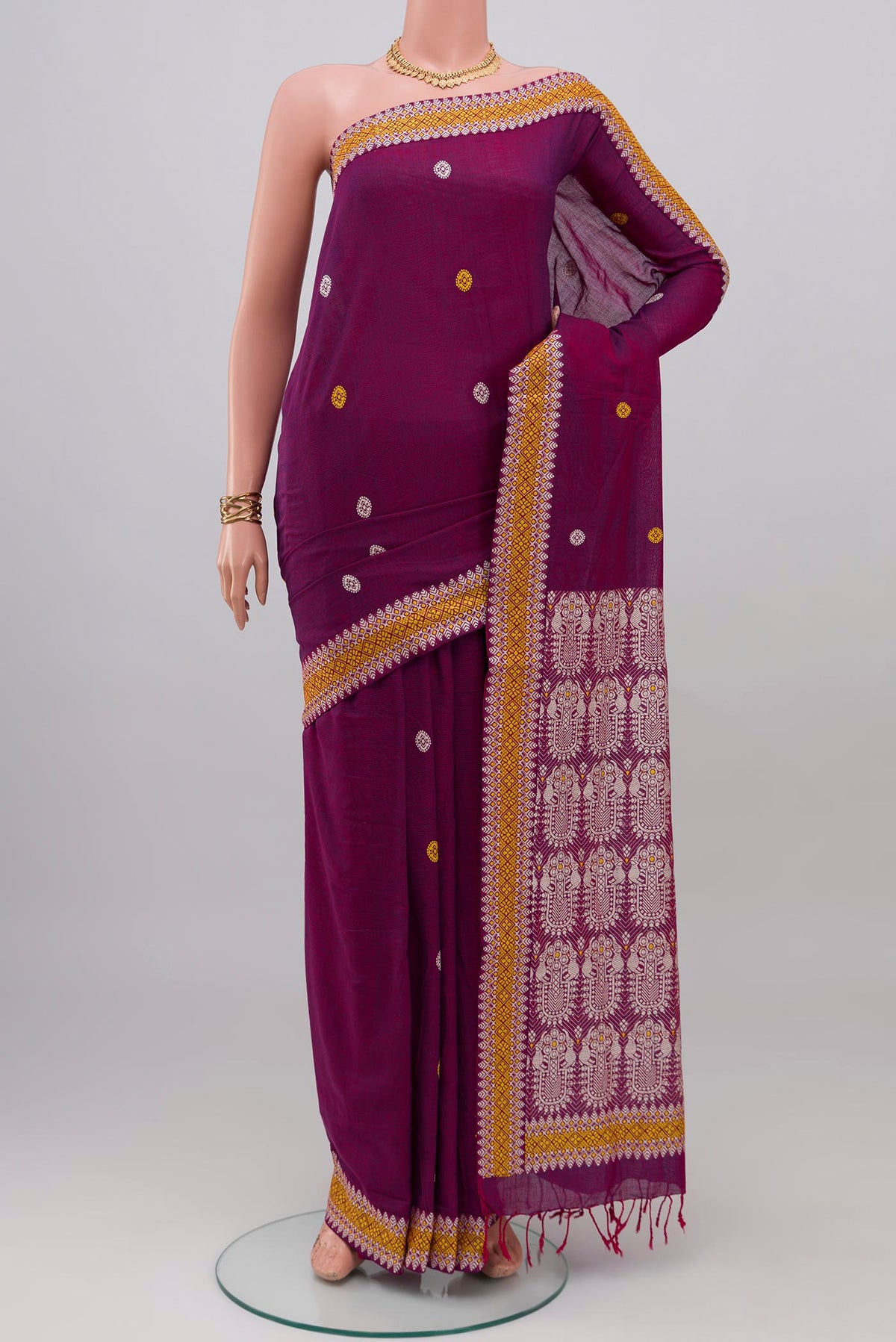 Purple Assam Cotton Saree with Thread Butta on the body and Thread Border.  displayed on a mannequin