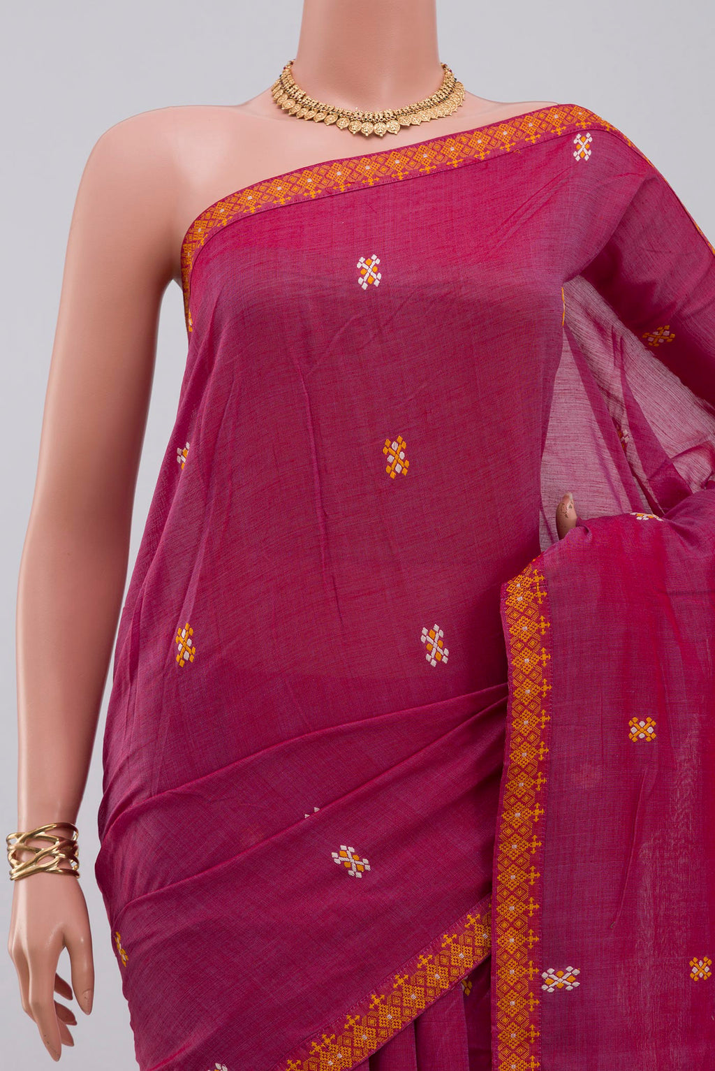 Border image of Pink Assam Cotton Saree with Thread Butta on the body and Thread Border. 