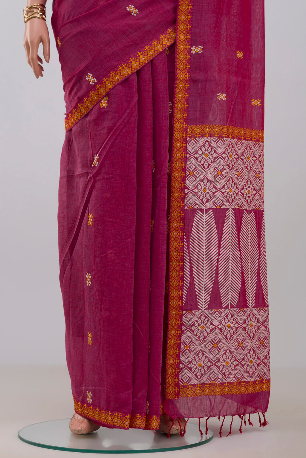 Pleats and pallu of Pink Assam Cotton Saree with Thread Butta on the body and Thread Border. 