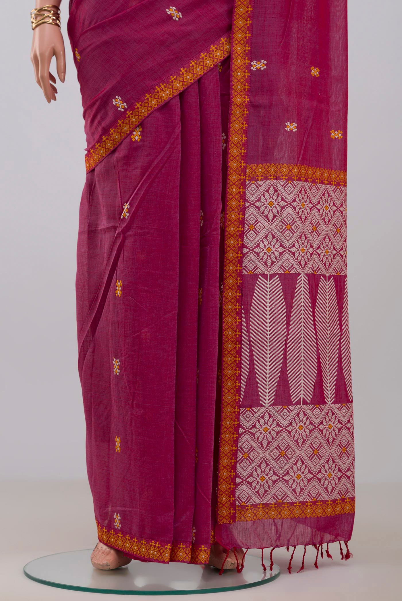 Pleats and pallu of Pink Assam Cotton Saree with Thread Butta on the body and Thread Border. 