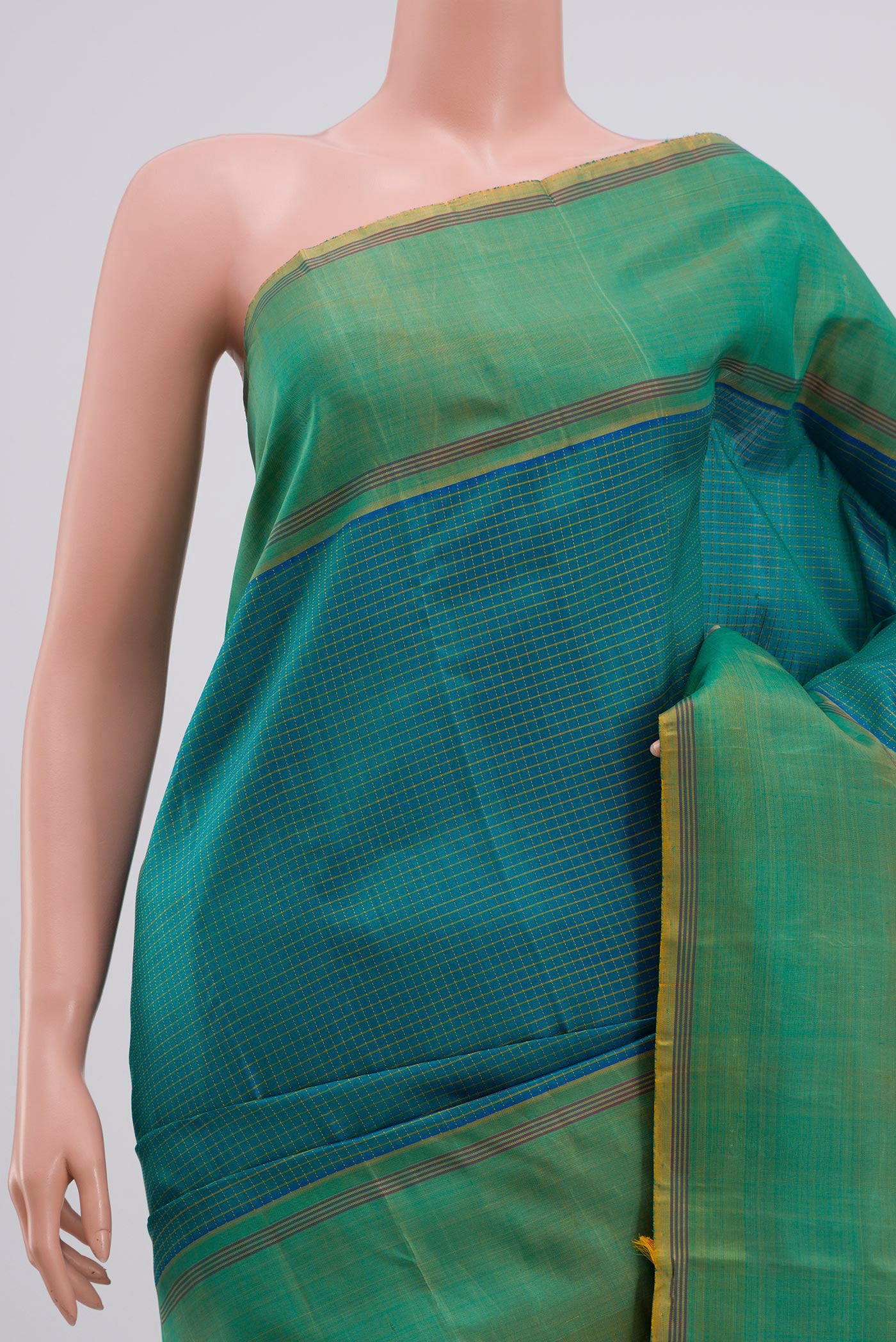Border image of Blue Kanchipuram Saree with Checked design on the body and Thread Border. 
