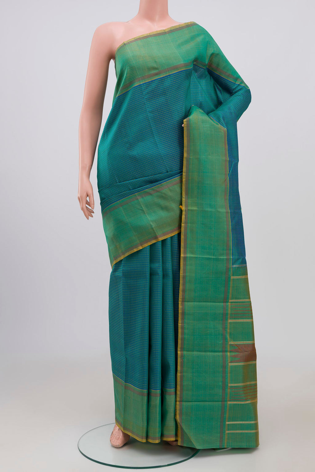Blue Kanchipuram Saree with Checked design on the body and Thread Border.  displayed on a mannequin