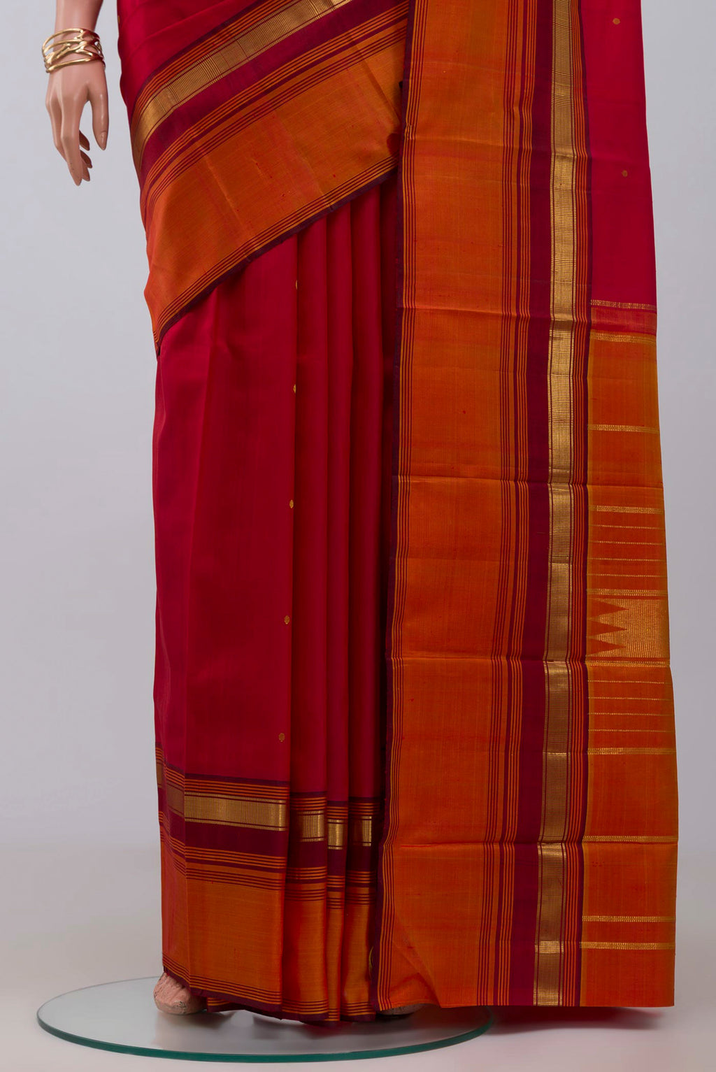 Pleats and pallu of Pure Silk Pure Zari Maroon Kanchipuram Saree with Zari Butta on the body and Zari Border. 