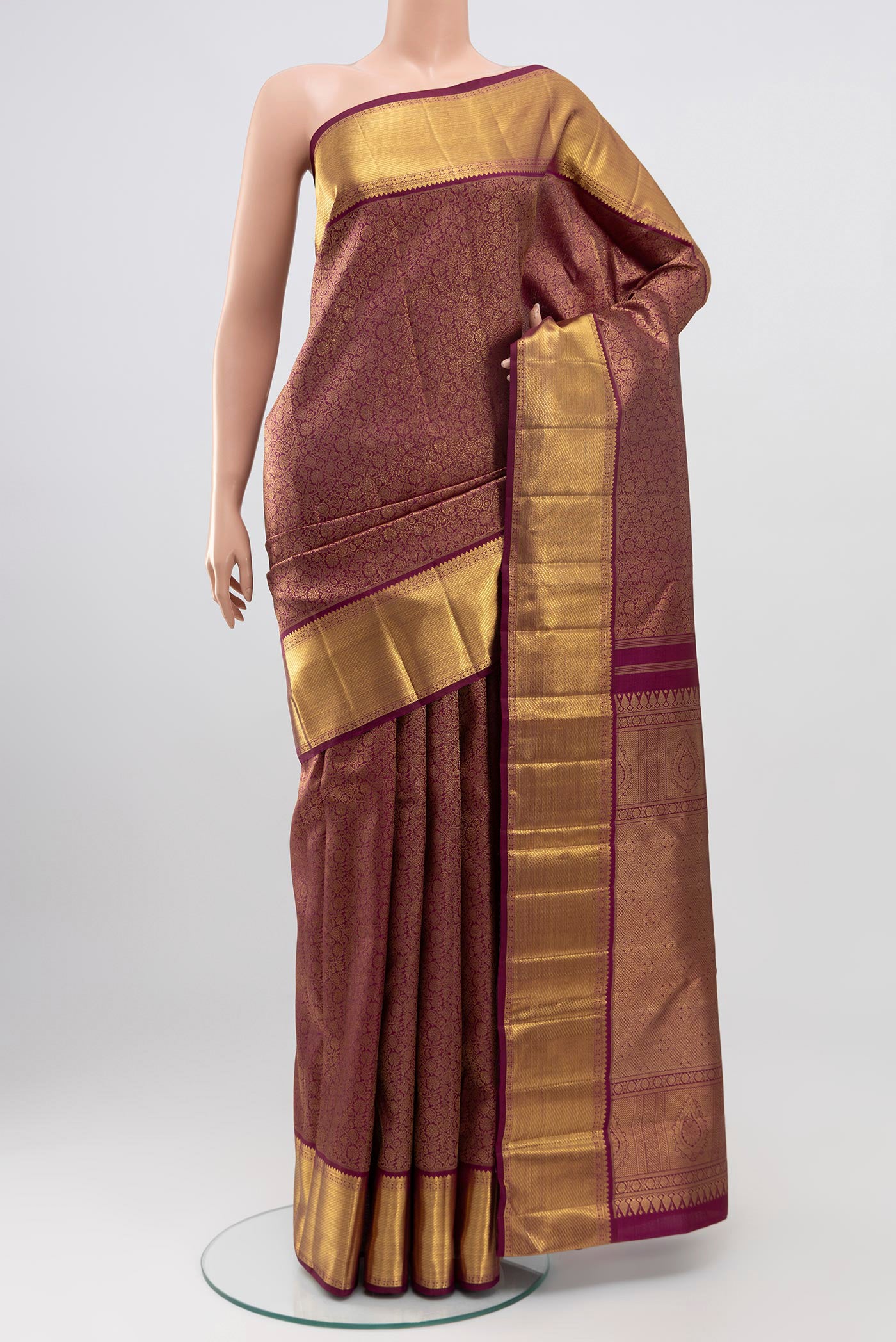 Purple Kanchipuram Saree with Zari Brocade on the body and Zari Border.  displayed on a mannequin