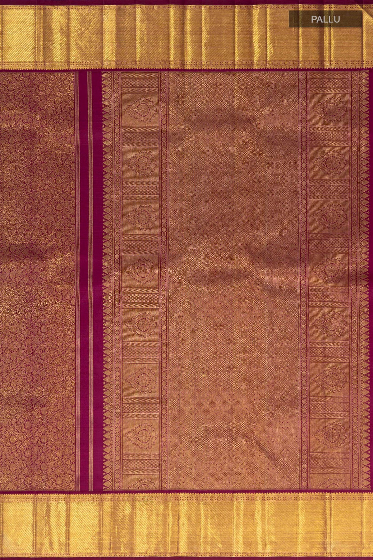 Close up image of the pallu of Purple Kanchipuram Saree with Zari Brocade on the body and Zari Border. 