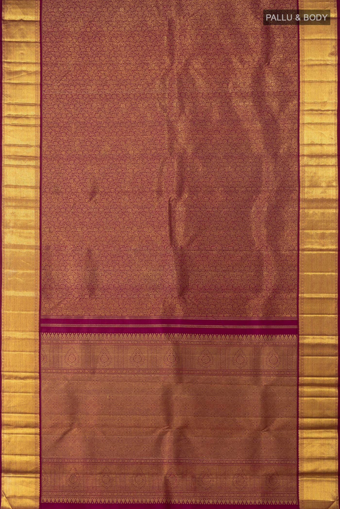 Flat view of Purple Kanchipuram Saree with Zari Brocade on the body and Zari Border. 