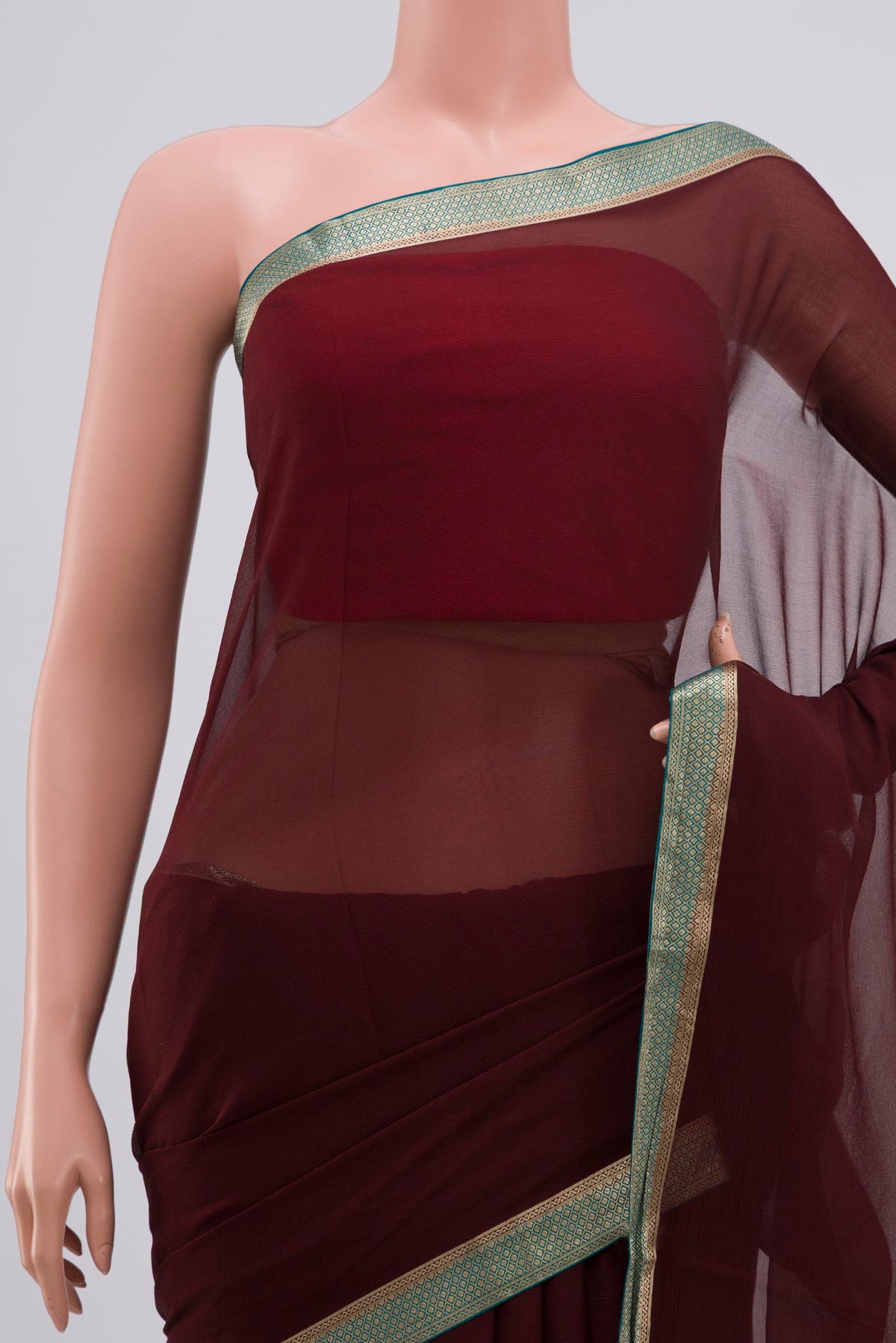 Border image of Brown Chiffon Saree with Plain Body and Zari Border. 