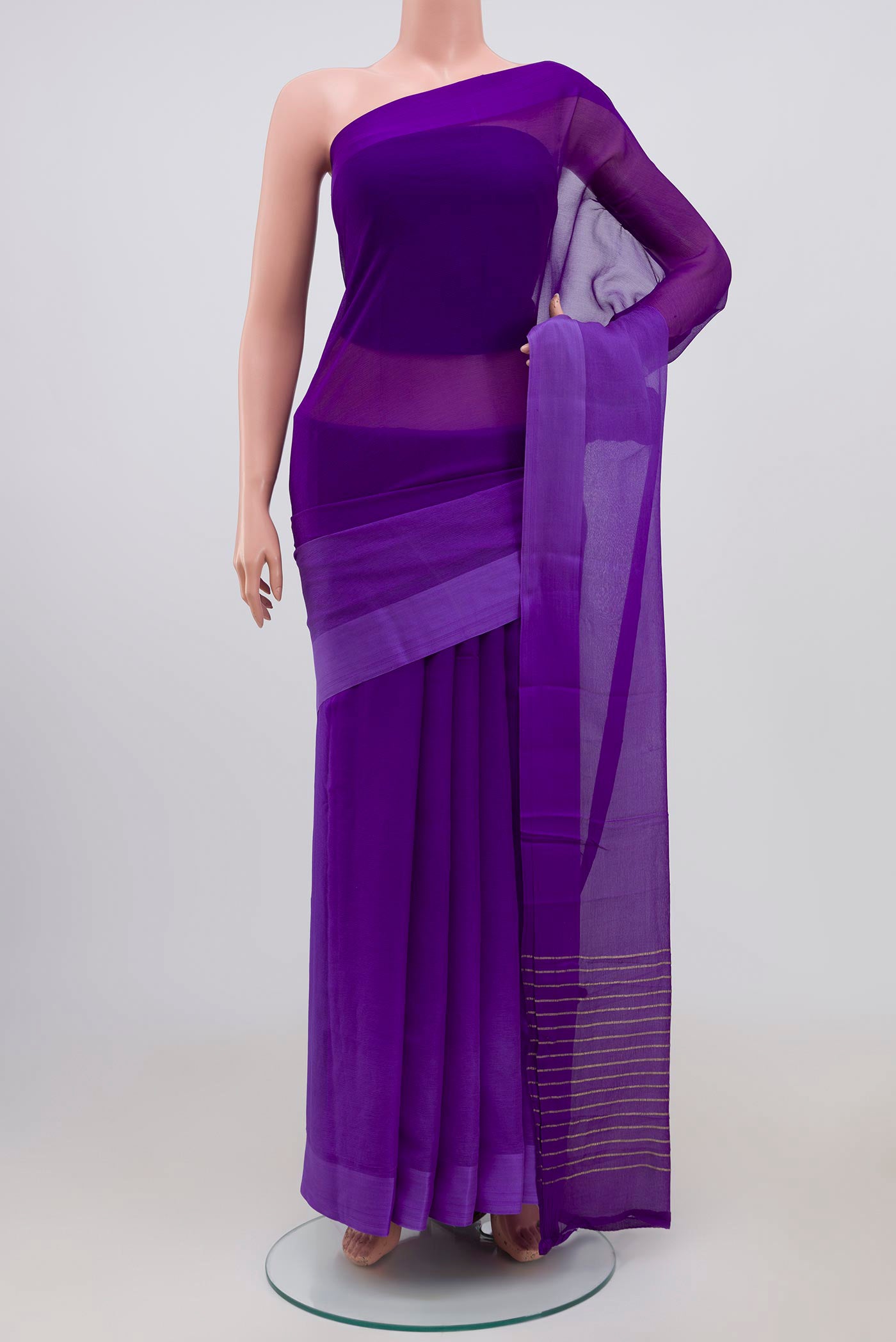 Navy Blue Chiffon Saree with Plain Body and Plain Border.  displayed on a mannequin